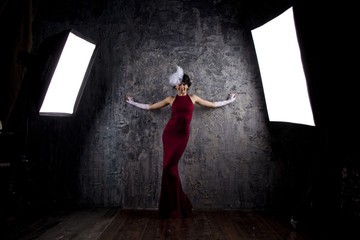 Fashion model in long red dress