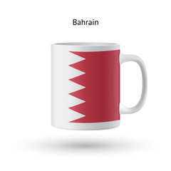Bahrain flag souvenir mug on white background.