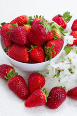 Plate of strawberries  with spring twigs