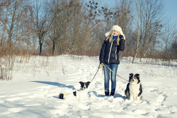 Girl on a walk with the dogs