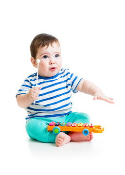 Cute baby playing  with musical toys