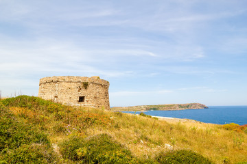 Fototapeta na wymiar Torre d’en Penjat uncared fort scenery at Menorca
