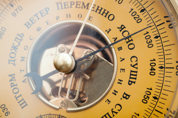 Closeup photo of vintage yellow Russian barometer
