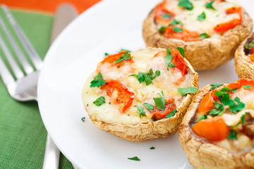 Mushrooms stuffed with mozzarella and tomato