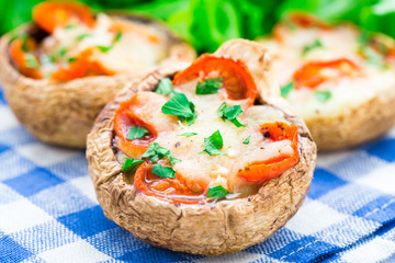 Mushrooms stuffed with mozzarella and tomato