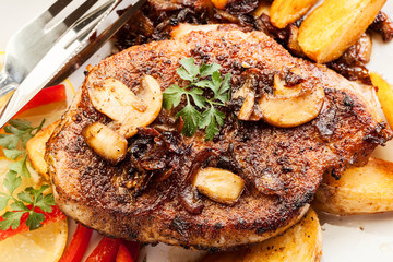Pork chop with mushrooms and chips
