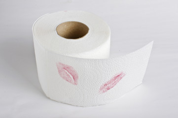 Lipstick prints on toilet tissue roll