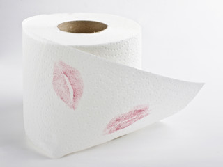 Lipstick marks on toilet tissue roll