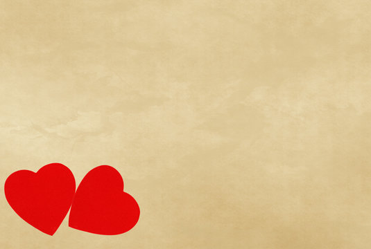 red hearts on vintage paper background with copyspace