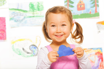 Paper cloud held by little girl