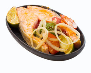 Salmon fillet with vegetables isolated on white background