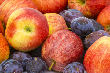 fresh apples and plums