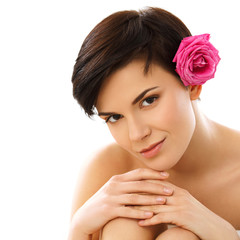 Naklejka premium Portrait of a Smiling Young Woman With Flower