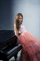 Portrait of woman with grand piano