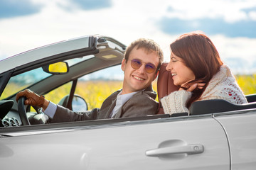 happy couple in the car