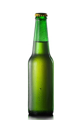 Beer bottle with water drops isolated on white