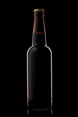 Beer bottle isolated on black