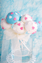 Wedding cake pops in white and soft blue.