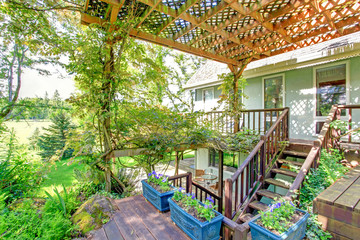 Farm house pergola with rustic flower pots