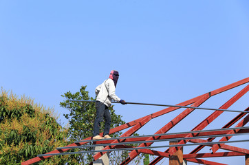 labor working in construction site for roof prepare