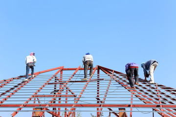 labor working in construction site for roof prepare