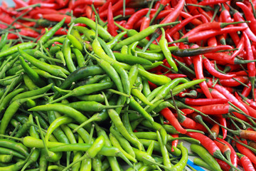 Green chili and red chili on the market.