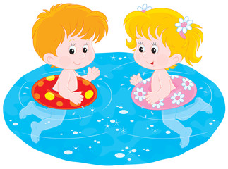 Children swim with inflatable circles