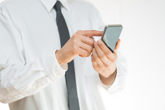 Close-up image of a man using a mobile smartphone