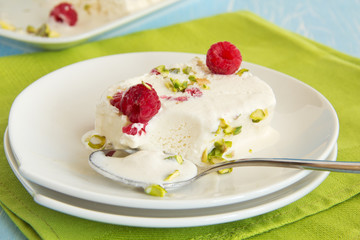 Yoghurt Semifreddo with raspberry and pistachio.