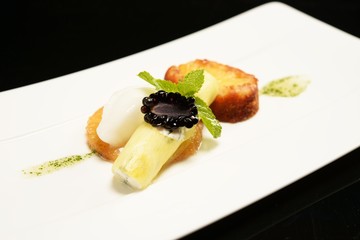 Piece of cake with fruits and ice-cream