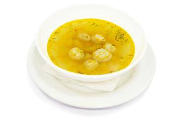 Soup with meatball and broth in plate, restaurant menu for child