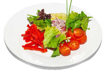 Vegetable salad pepper tomato onion lettuce and rocket on