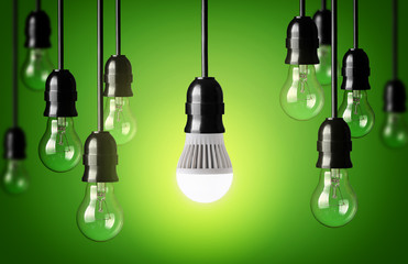 LED bulb and simple light bulbs.Green background