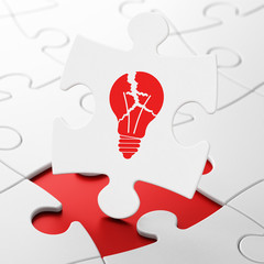 Business concept: Light Bulb on puzzle background