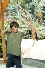 portrait of a child, archery, outdoor