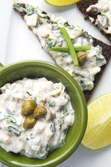 sandwiches with dark bread, herrings, mushrooms, pepper