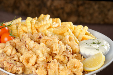 Fried calamari, pomes frittes,fried squid with lemon