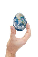 Human hand holding egg shaped planet earth.