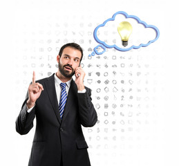 Young businessmen talking to mobile over isolated background.