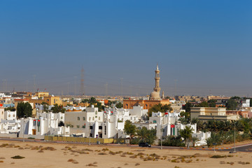 Suburban view of urban housing and local mosque in Abu Dhabi UAE