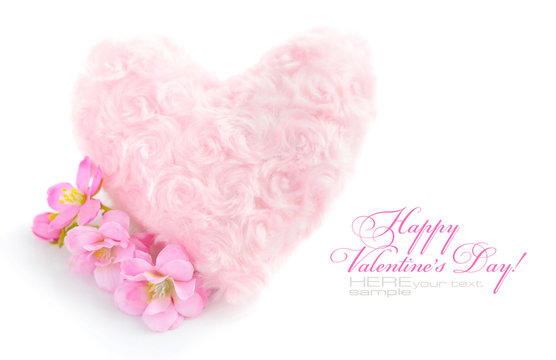 Fur pink heart with a pink flowers on white background