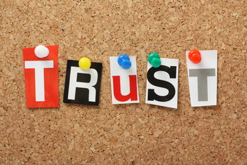 The word Trust on a cork notice board