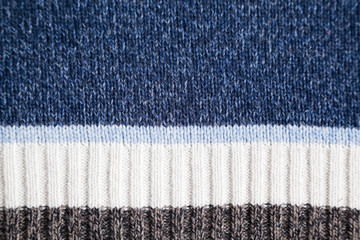 blue woolen fabric with stripes and selective focus