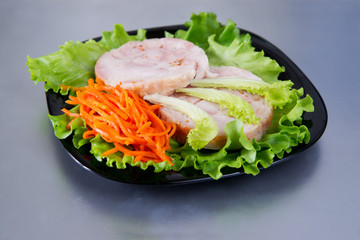 Chicken roulade on salad.