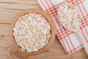 Wooden plate with cereal.