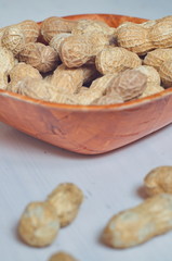 Peanuts in a brown bowl