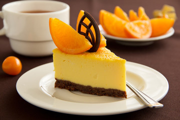 Delicious cheesecake with orange and chocolate.