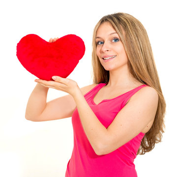 young woman holding a red heart