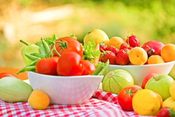 Obraz na płótnie Canvas Fresh organic fruits and vegetables on a table