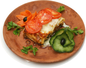 Italian pasta with yellow cheese and vegetables